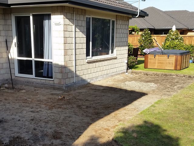 Digging out the old concrete patio
